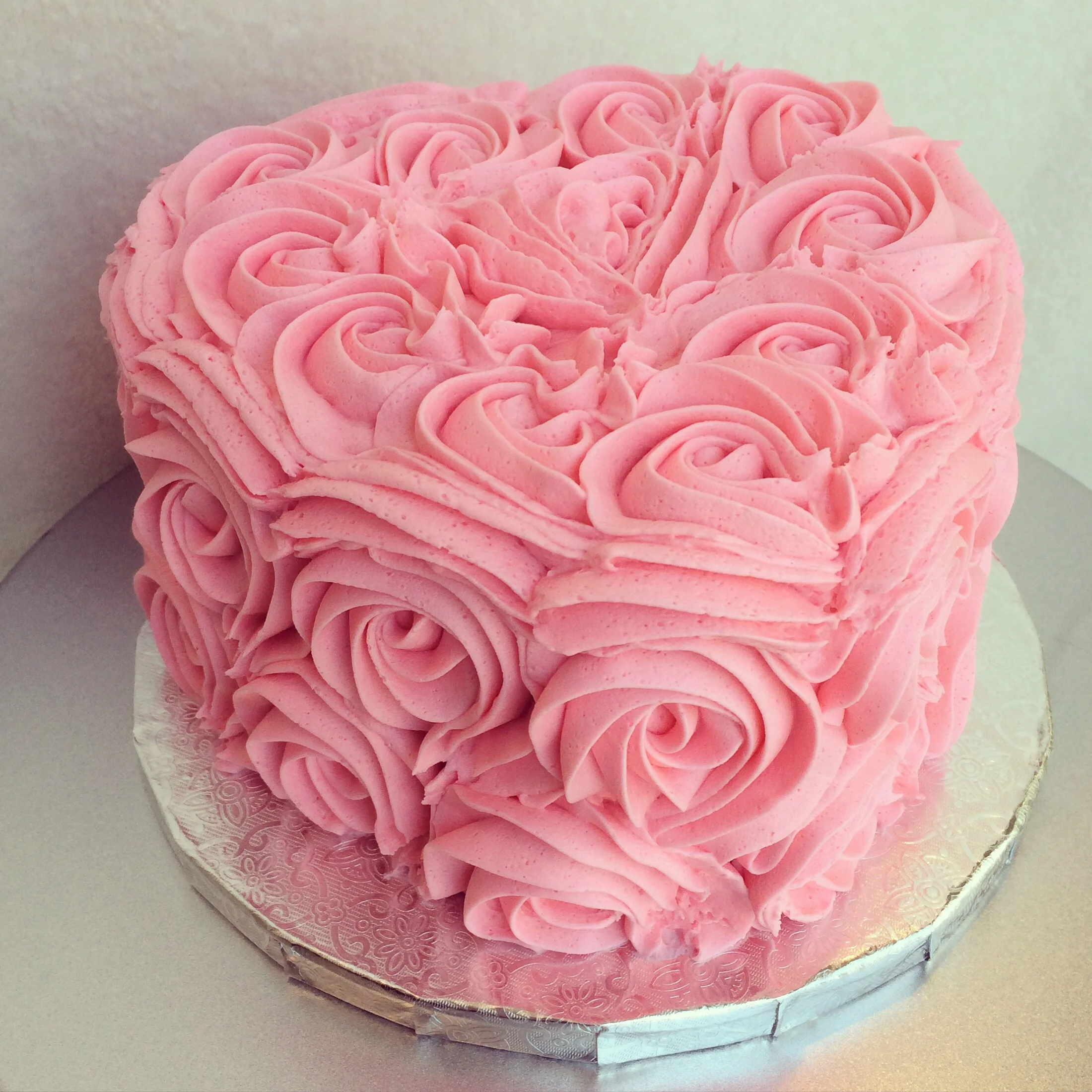 First birthday smash cake in a heart shape for the day after Valentine's Day