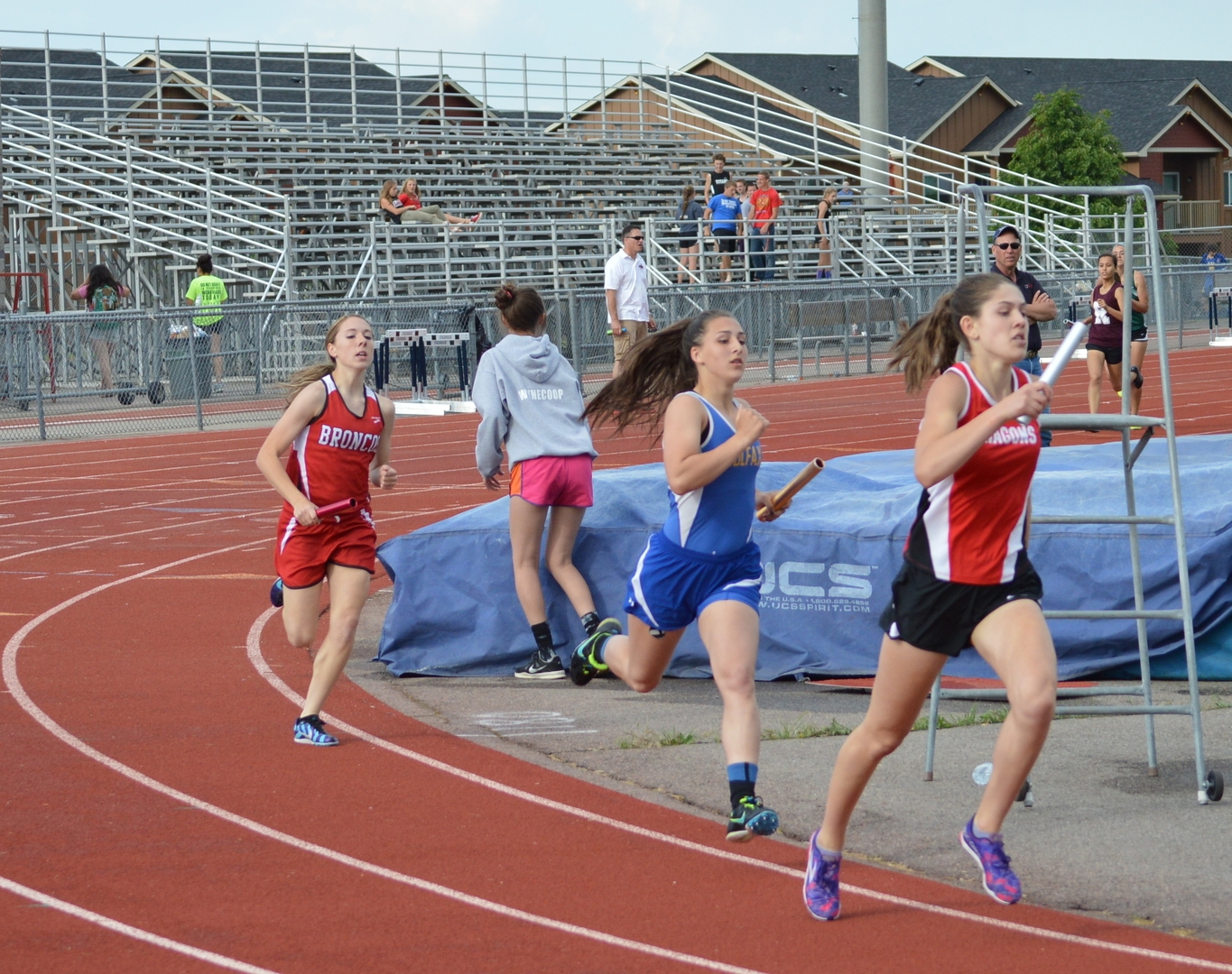 Madison Ward, St. George Academy, in the lead of the 4x400 relay.