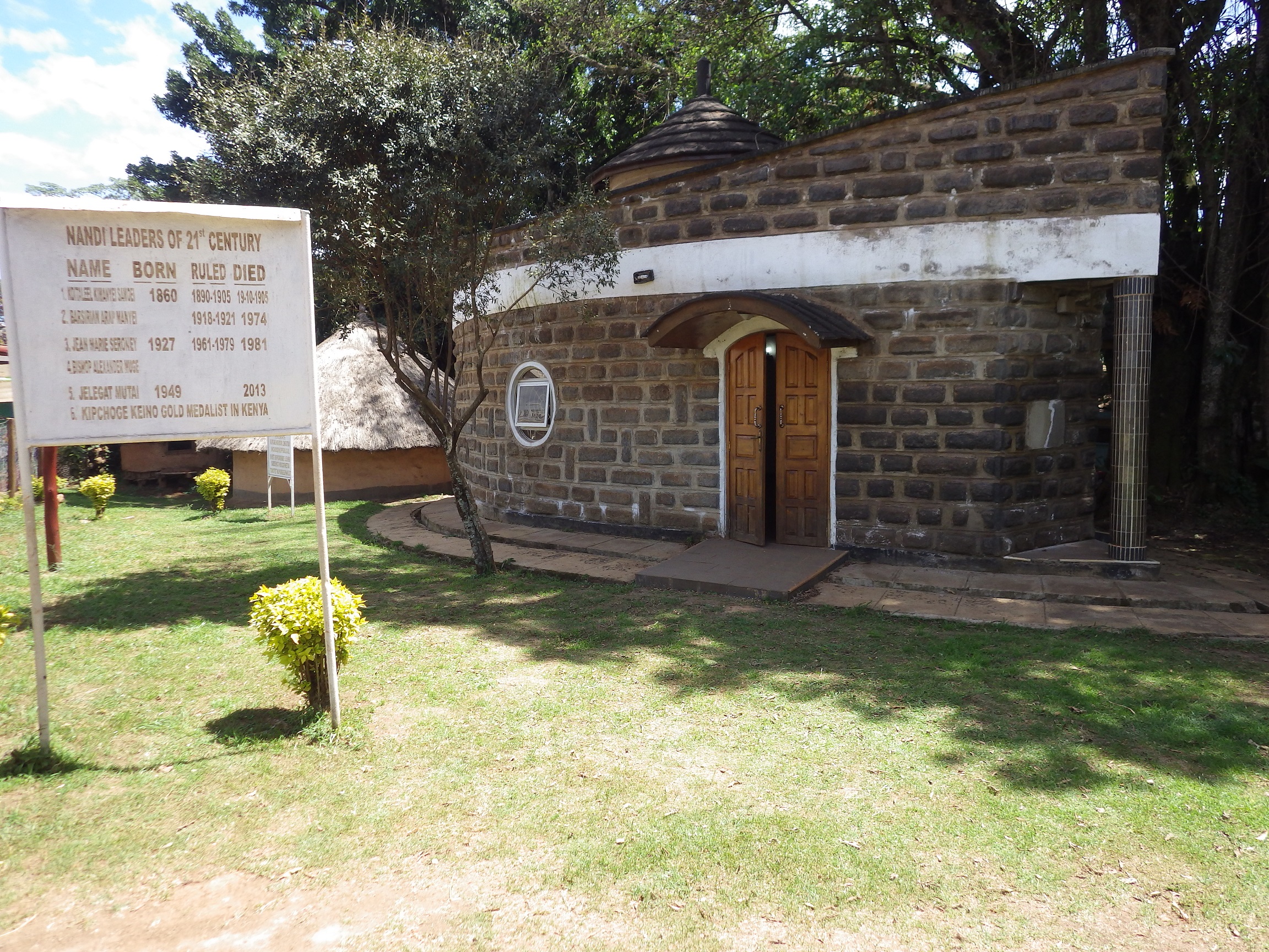 The mausoleum with a symbolic olive tree in front.