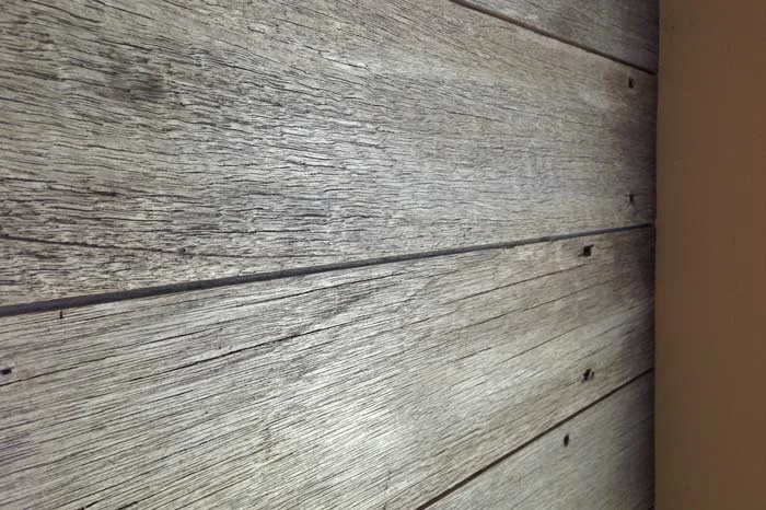 The un-mistakeable, un-fakeable soft gray of a weathered and aged tropical hardwood. Reclaimed Silvered Dinizia will hit it home in a gray wood wall.
