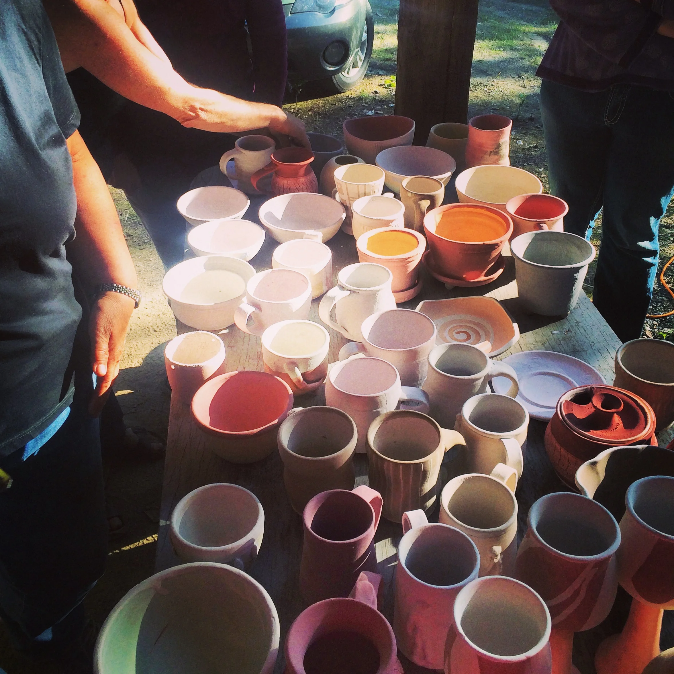 Local potters made work specially for this last firing of the historic kiln. Getting them lined up and ready to go!
