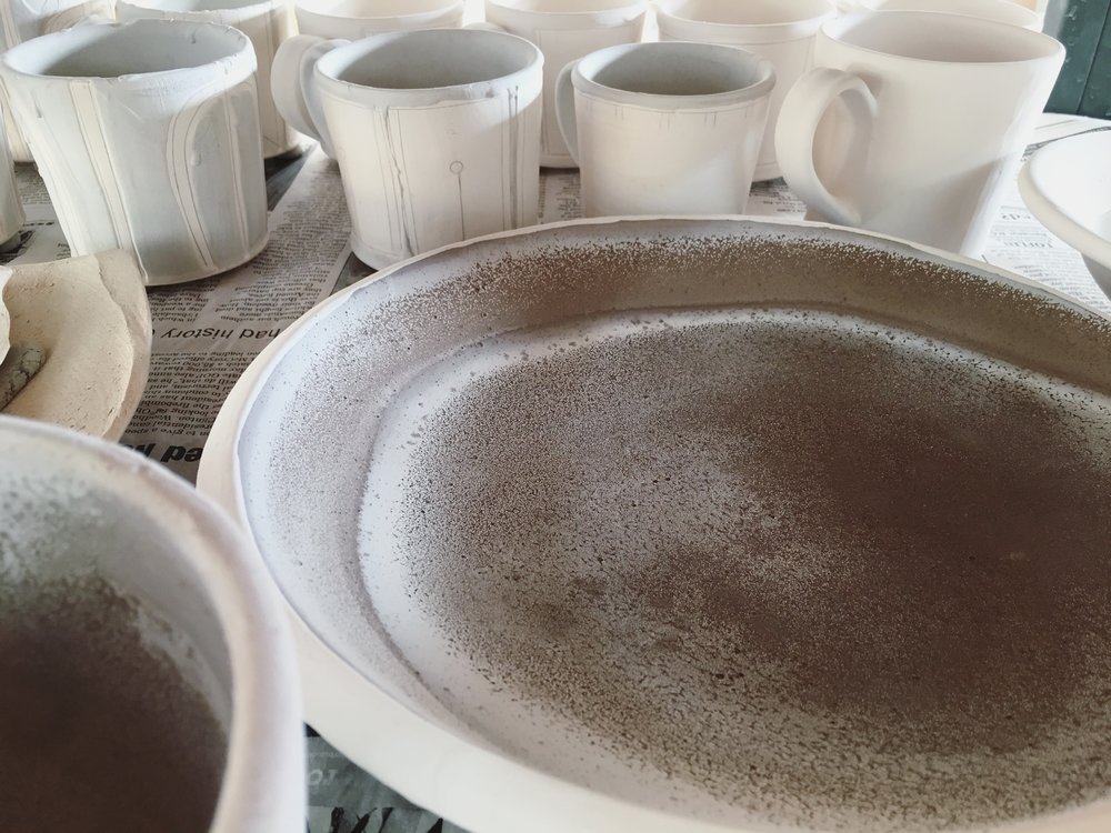  For this place setting, I used a shino glaze which contains soda ash. &nbsp;As the glaze dries, the soda effloresces to the surface creating a unique pattern and even more interesting glazed surface. 