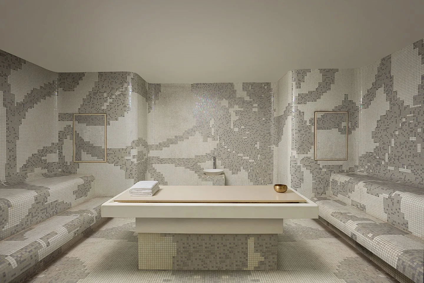 Hammam steam room with iridescent mosaic tile walls  and central marble treatment table — Le Méridien  Mahabaleshwar Resort & Spa