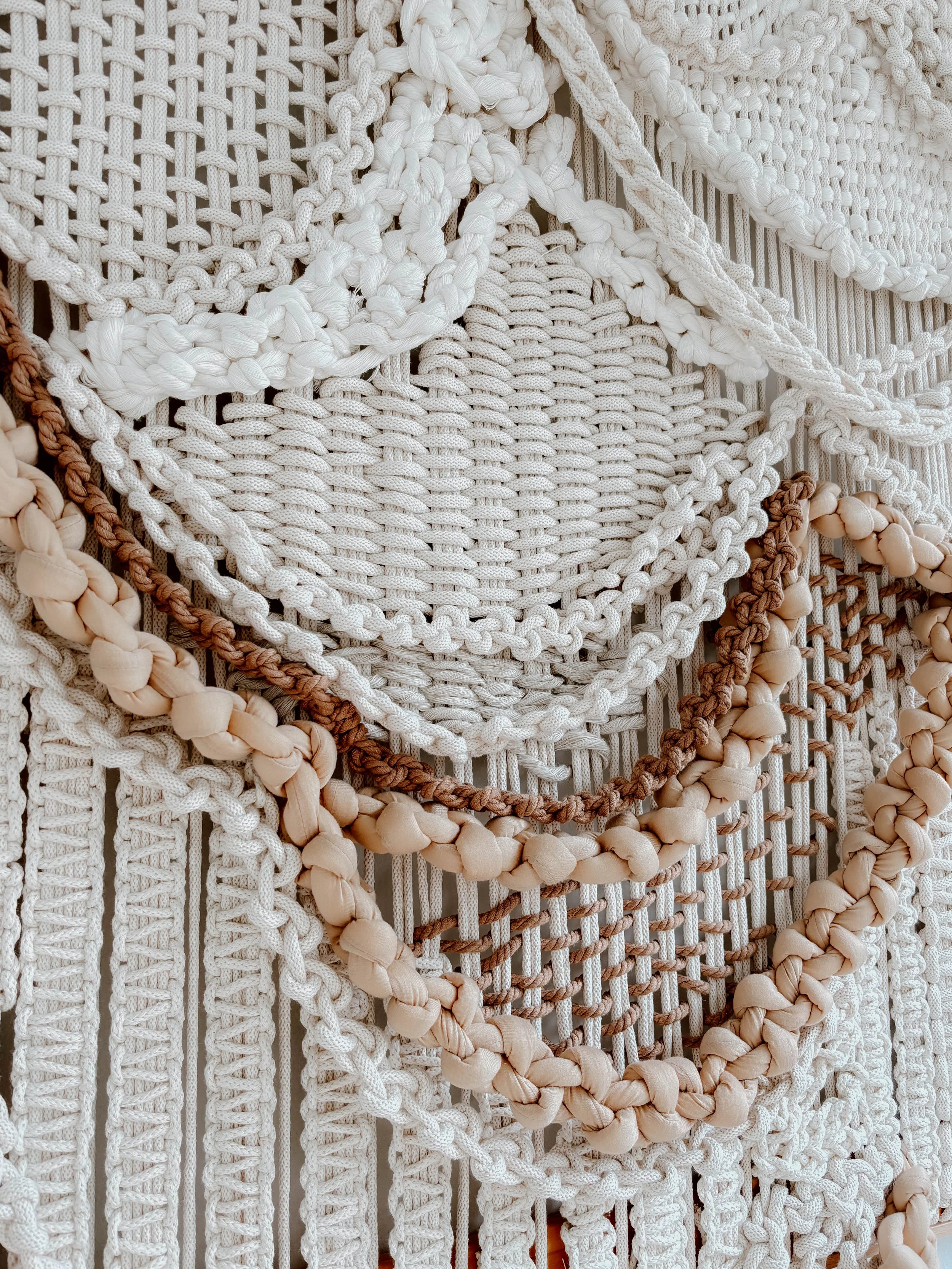 CASCADING SYMPHONY hand-knotted sensory art by Belén Senra featuring intricate cascading chain details and complex knotwork in natural cotton, 100x150cm architectural textile mounted on wall