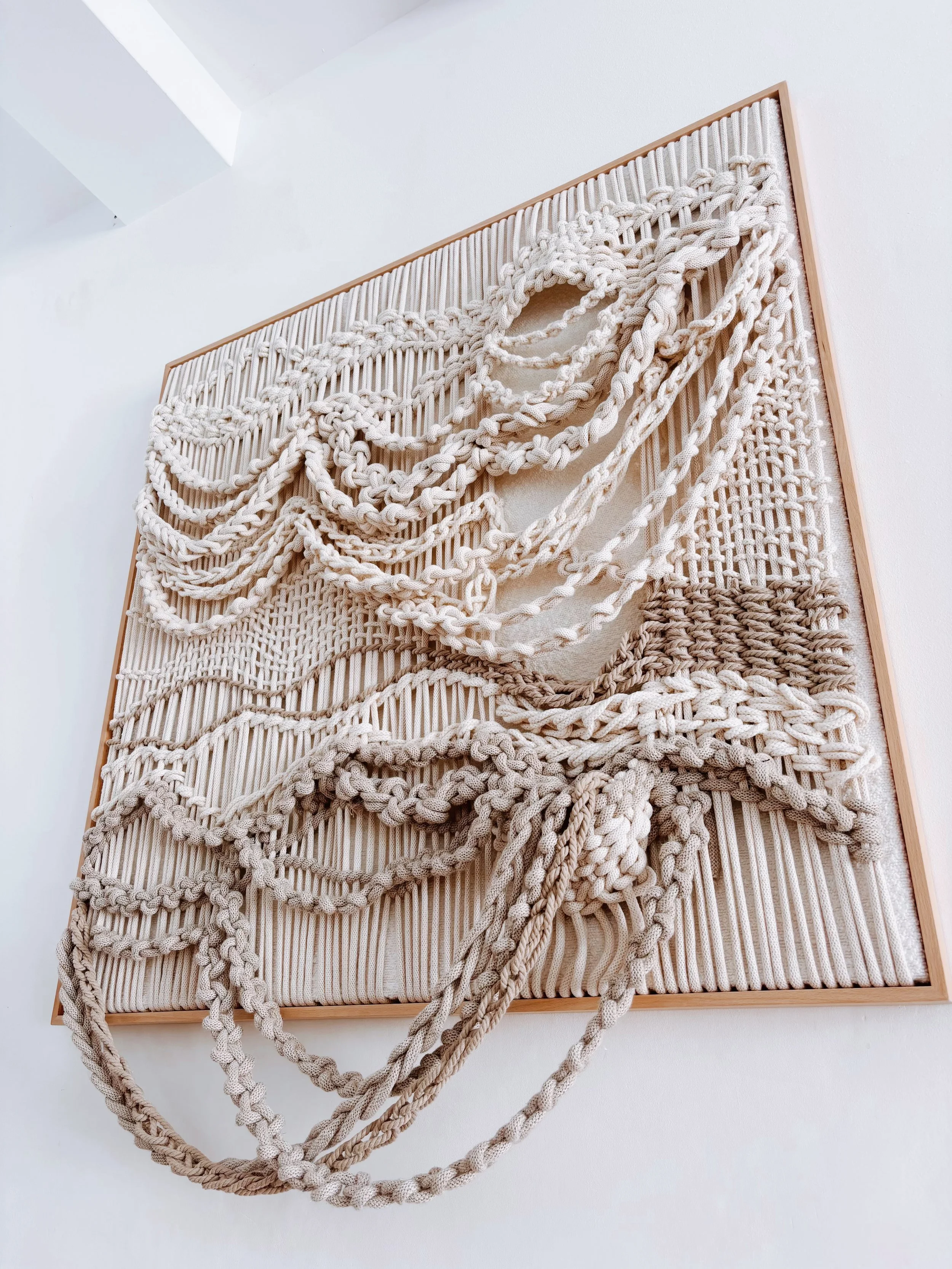 Discover Aleka, a handmade contemporary macramé wall artwork by Belén Senra. Made-to-order textile art crafted with natural cotton and linen for luxury interiors and contemporary art collectors