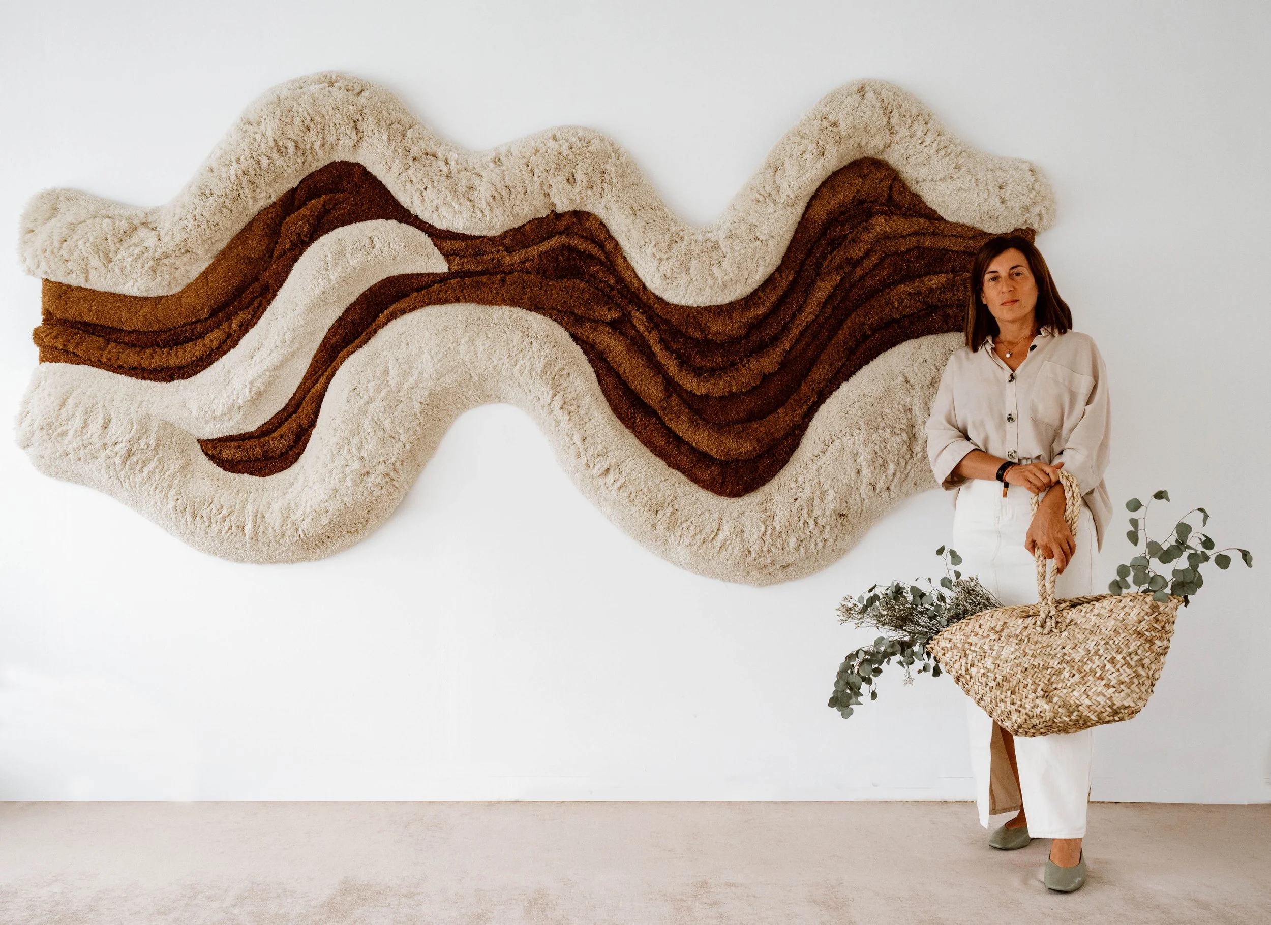 Contemporary fiber wall art Flowing Waves displayed as a statement textile piece with flowing layered forms and natural materials.