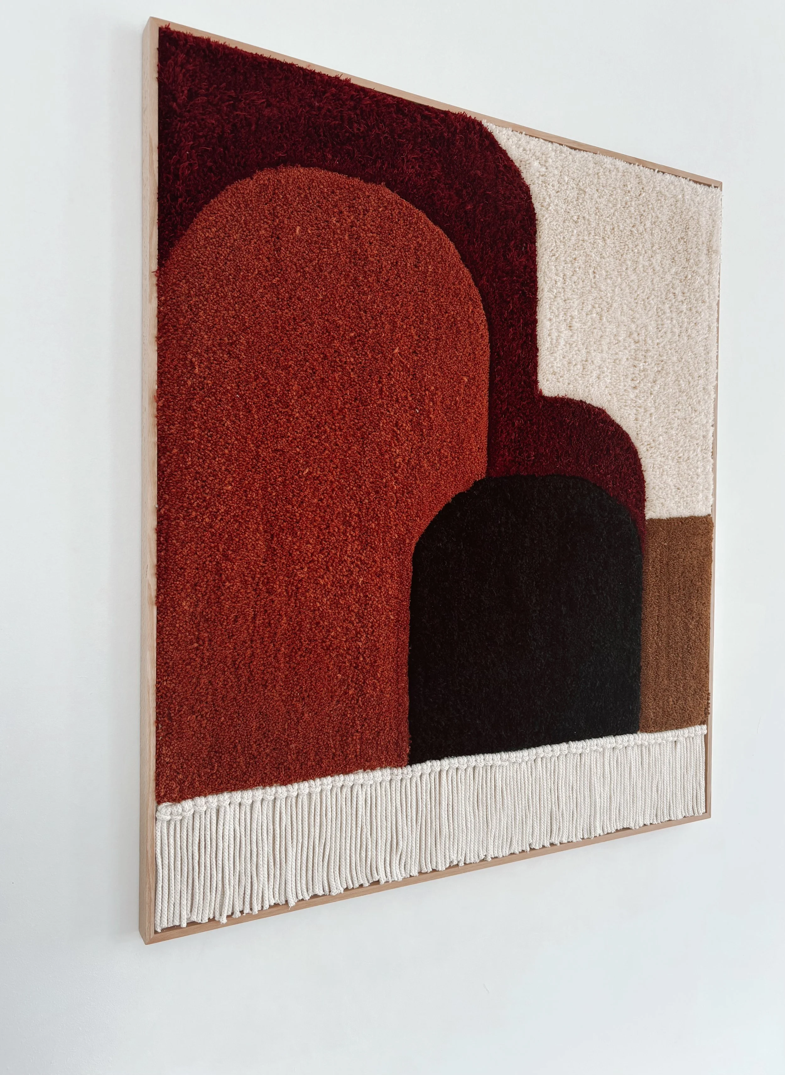 Holding Space is an original framed hand-tufted textile artwork by Belén Senra. A contemporary fiber art piece that adds depth, texture and architectural character to sophisticated interiors
