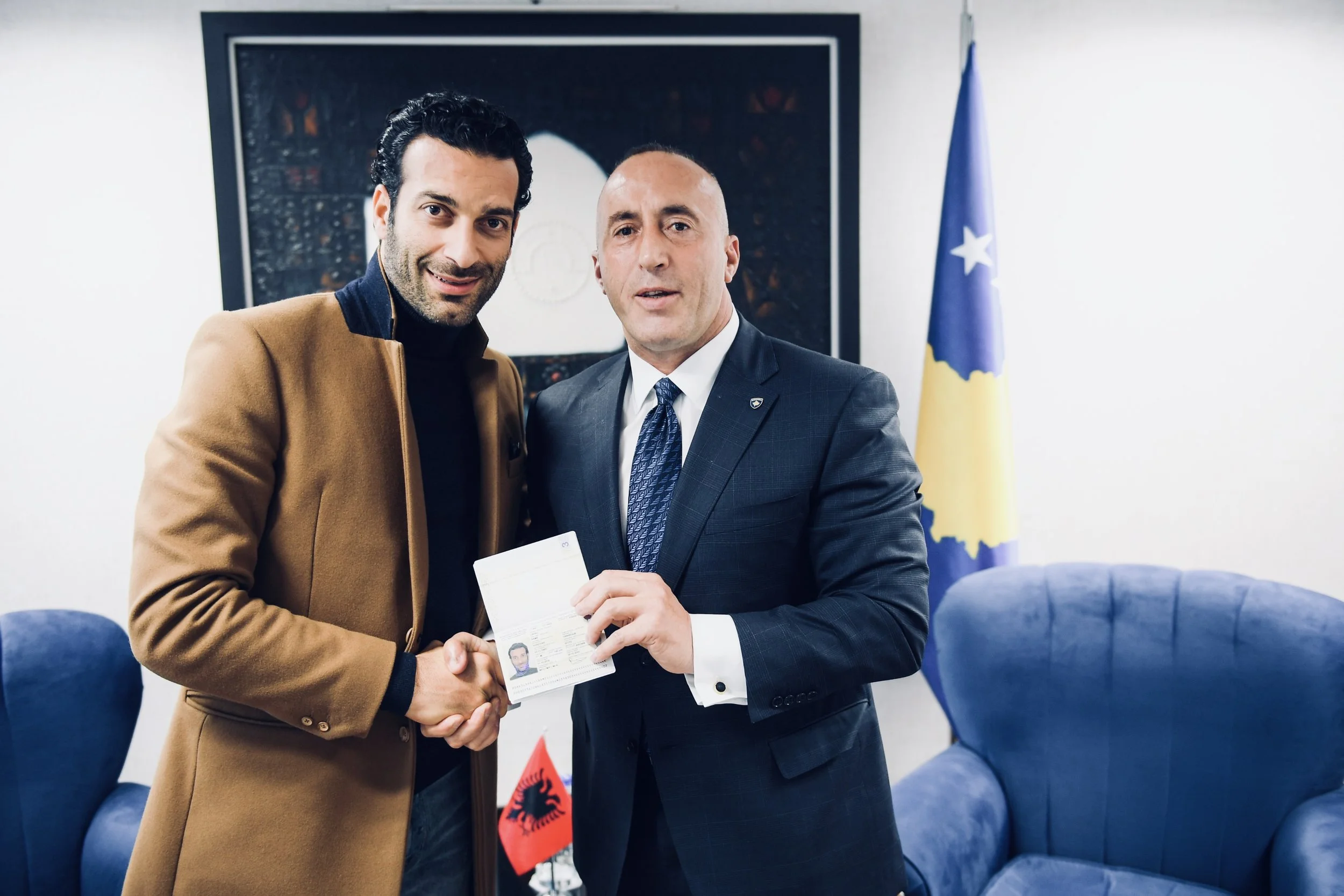 Rame Lahaj receiving diplomatic passport by Kosovan Prime minister, Ramush Haradinaj. Officially during this ceremony Lahaj became global Ambassador for Culture.