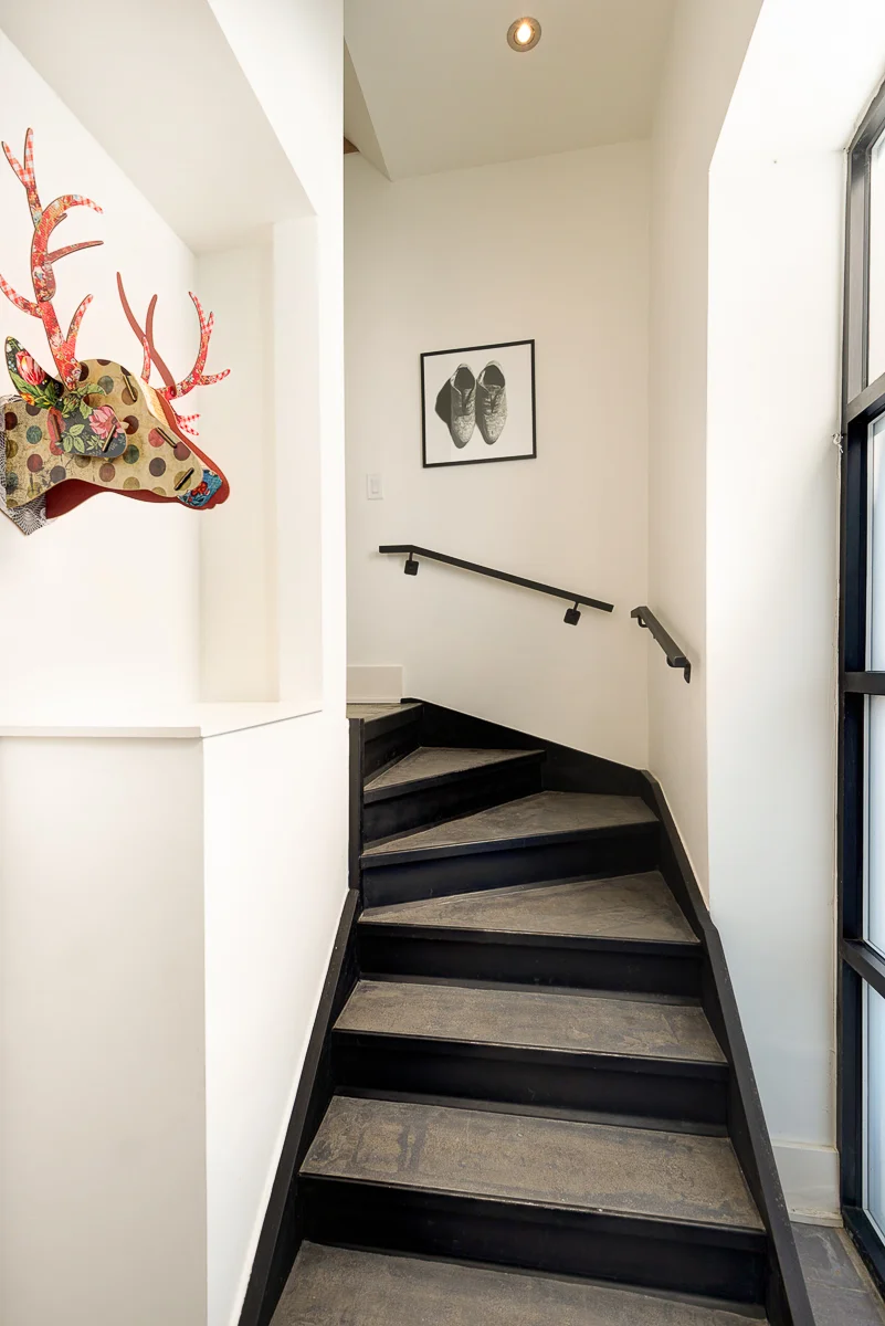 Main entrance, with staircase leading up to loft space.