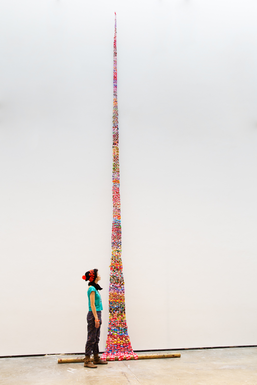   In the future, they kept alive what ancestral rites they could remember , 2014,&nbsp;plastic holiday-themed tablecloth, shipping tube, faux wood, 360 x 72 inches 