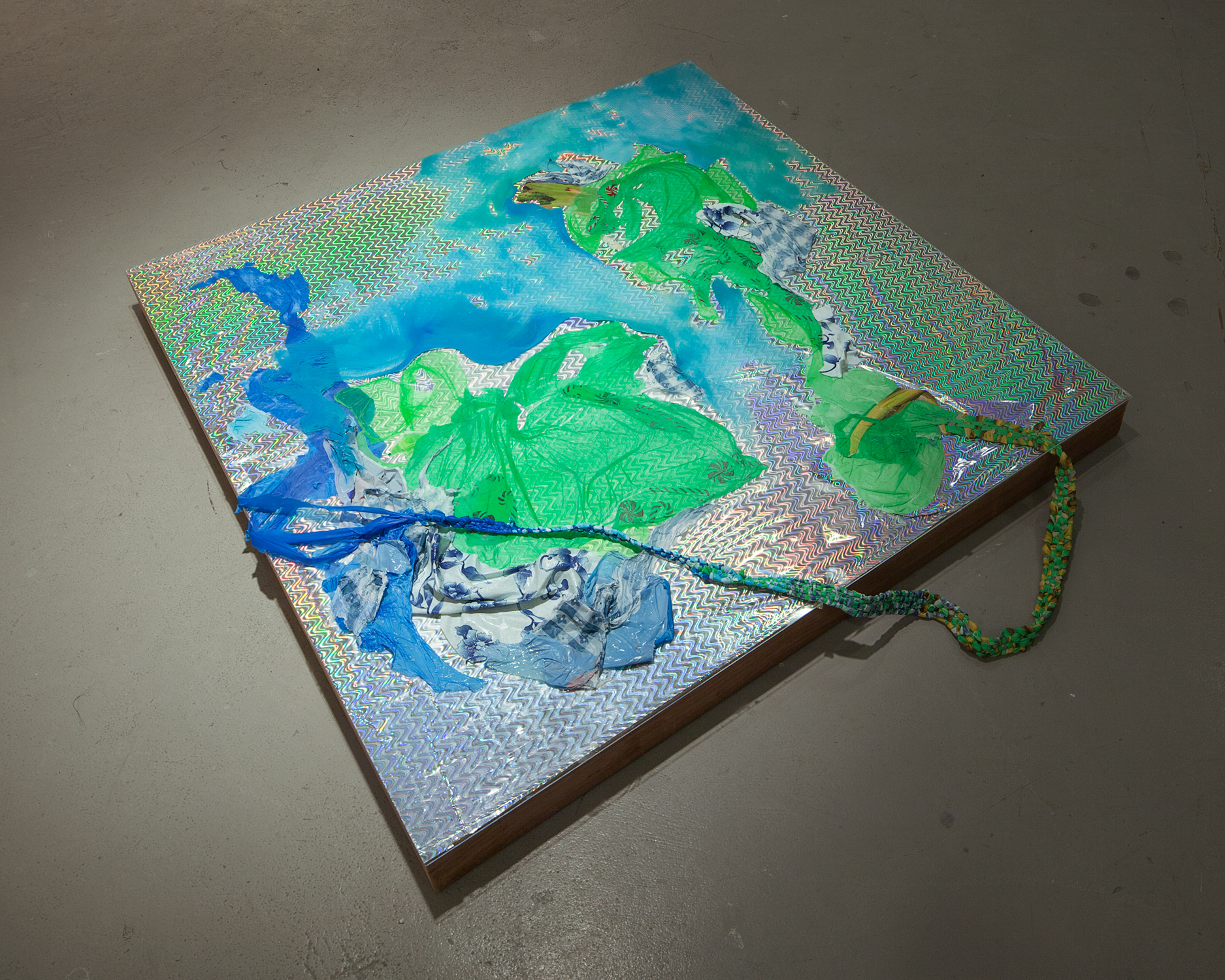   Flashplain , 2015, Oil, plastic, plexiglass, found paper, wood, 48 x 48 x 4 inches 