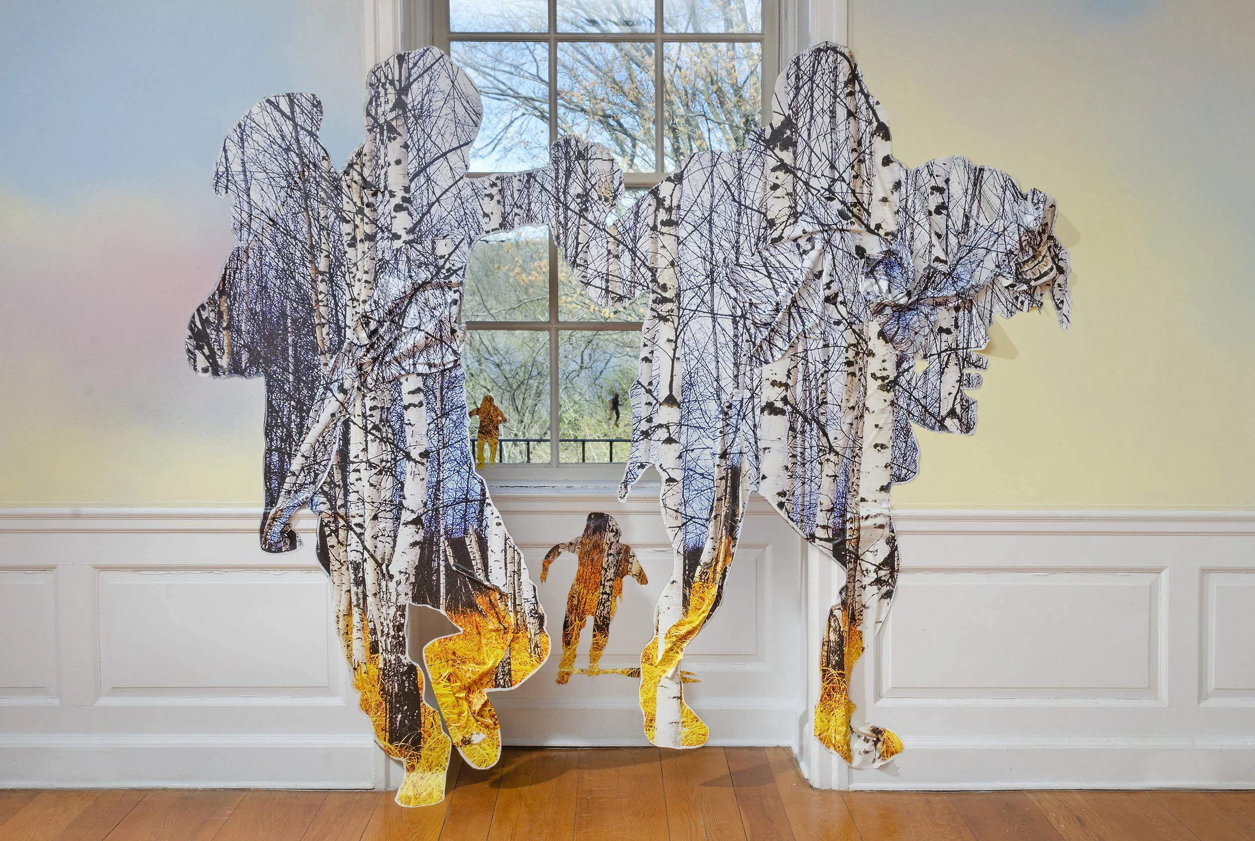 Las Américas (en el hogar) / Americas (in the hearth) , Wave Hill, 2019, Acrylic paint, stock aspen forest vinyl ordered from Amazon, aspen logs, aspen excelsior anti-erosion blanket. Work courtesy of the artist. Image: Stefan Hagen. More info HERE
