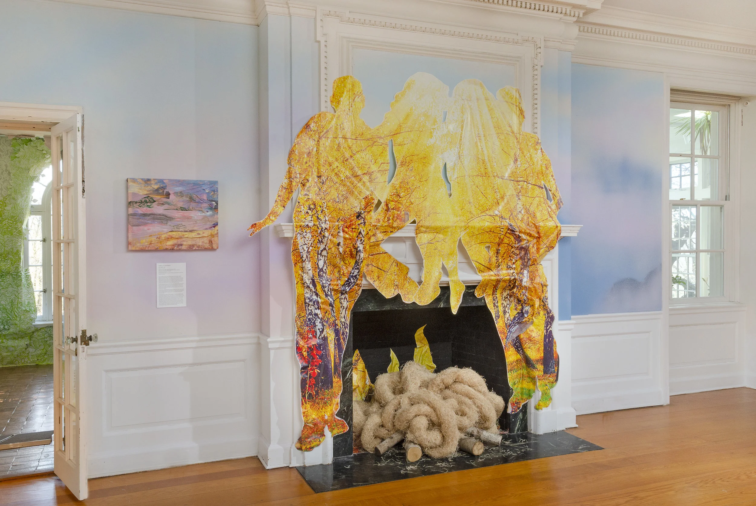 Las Américas (en el hogar) / Americas (in the hearth) , Wave Hill, 2019, Acrylic paint, stock aspen forest vinyl ordered from Amazon, aspen logs, aspen excelsior anti-erosion blanket. Work courtesy of the artist. Image: Stefan Hagen. More info HERE