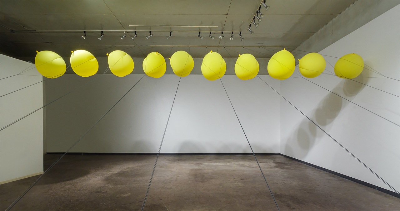   Slow Release   2014  balloons, parachute cord, hardware  dimensions variable 