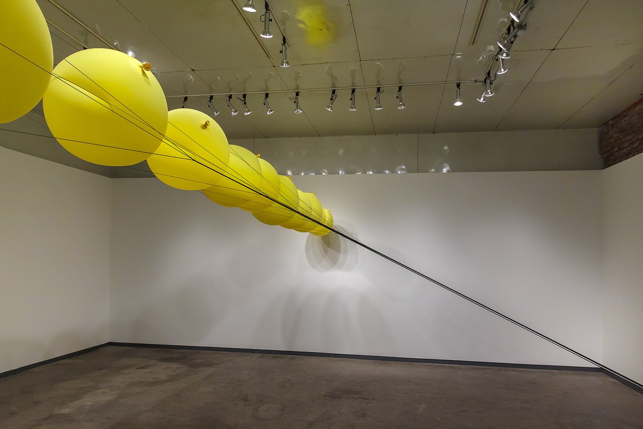   Slow Release   2014  balloons, parachute cord, hardware  dimensions variable 