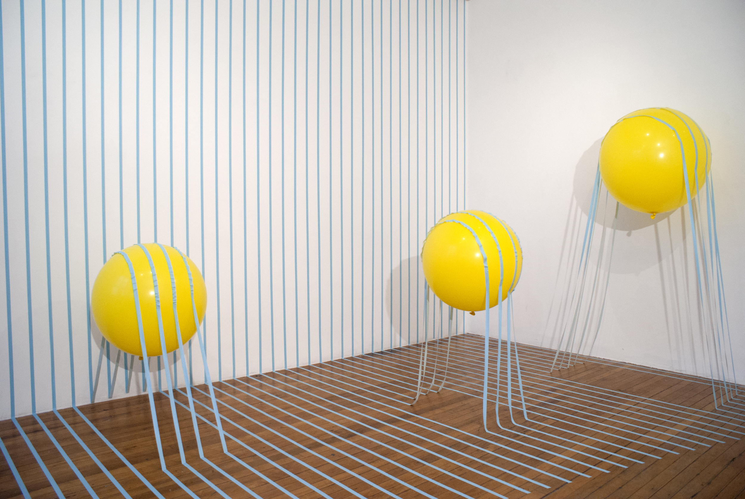 Buoyant Loss 2014 artist tape, balloon, and helium 120”x180”x120”
