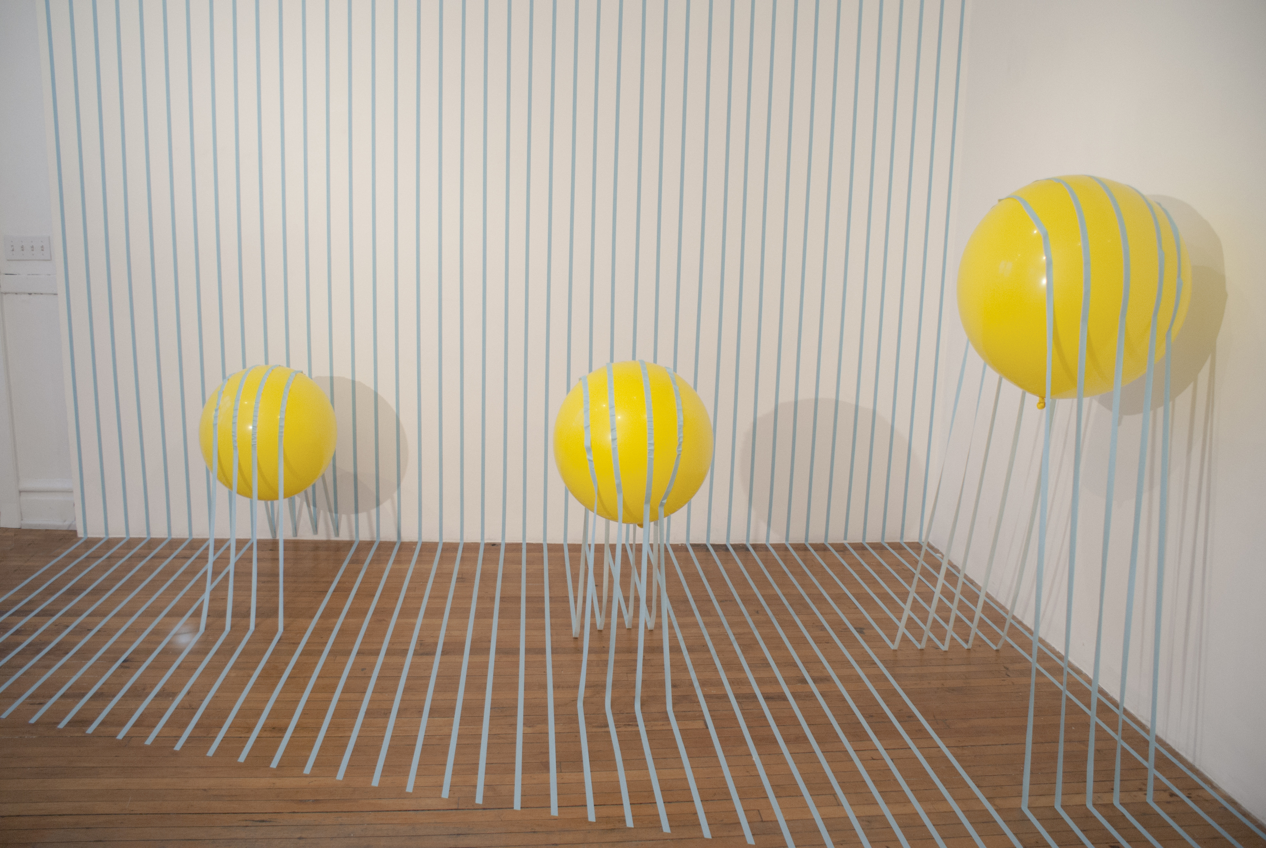 Buoyant Loss 2014 artist tape, balloon, and helium 120”x180”x120”