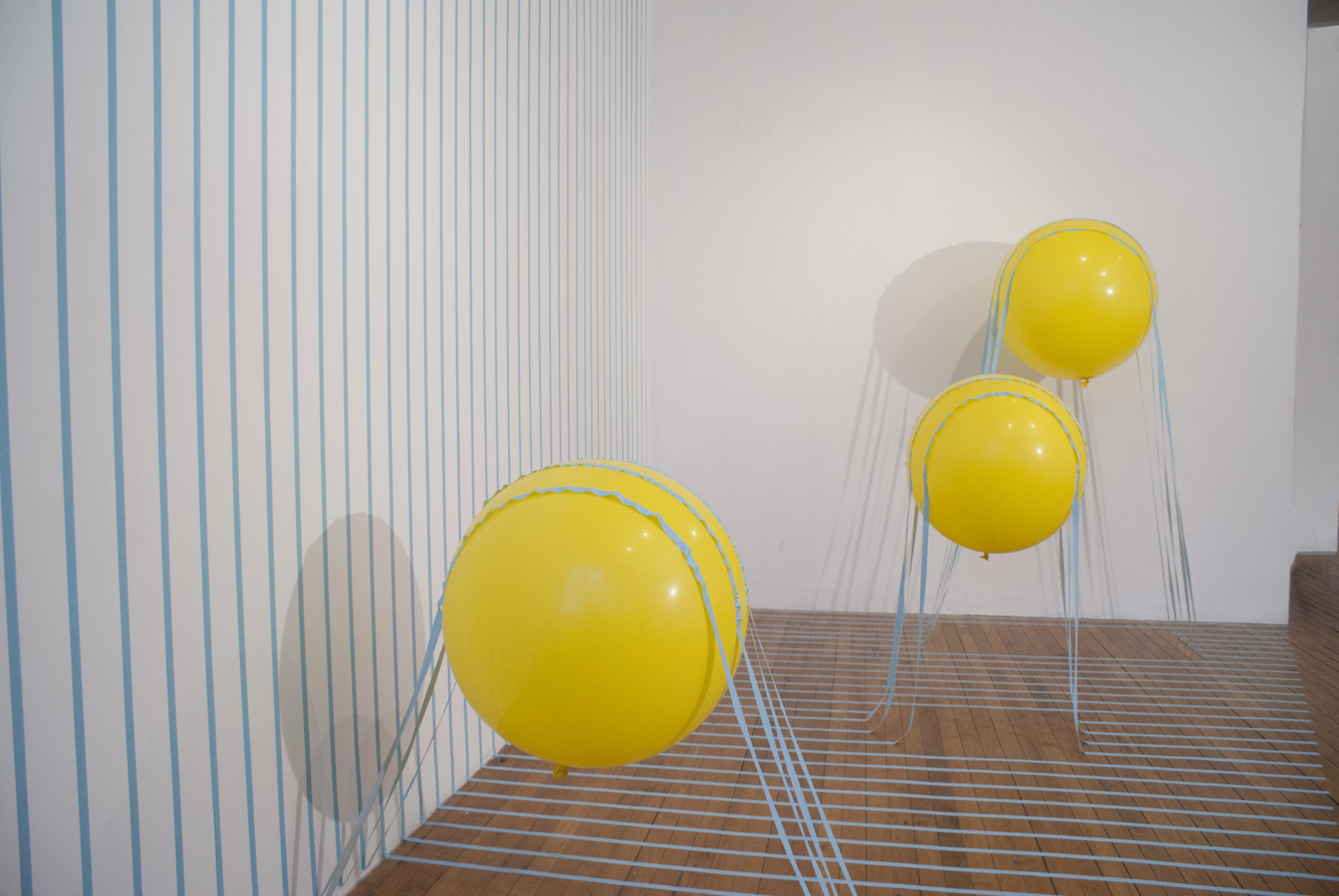 Buoyant Loss 2014 artist tape, balloon, and helium 120”x180”x120”