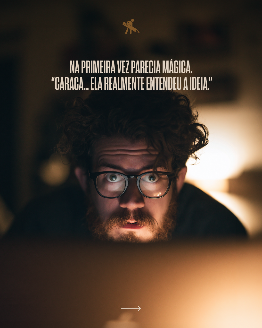 A man with curly hair, glasses, and a beard looks at a screen with an intense expression, illuminated by the glow of the screen.