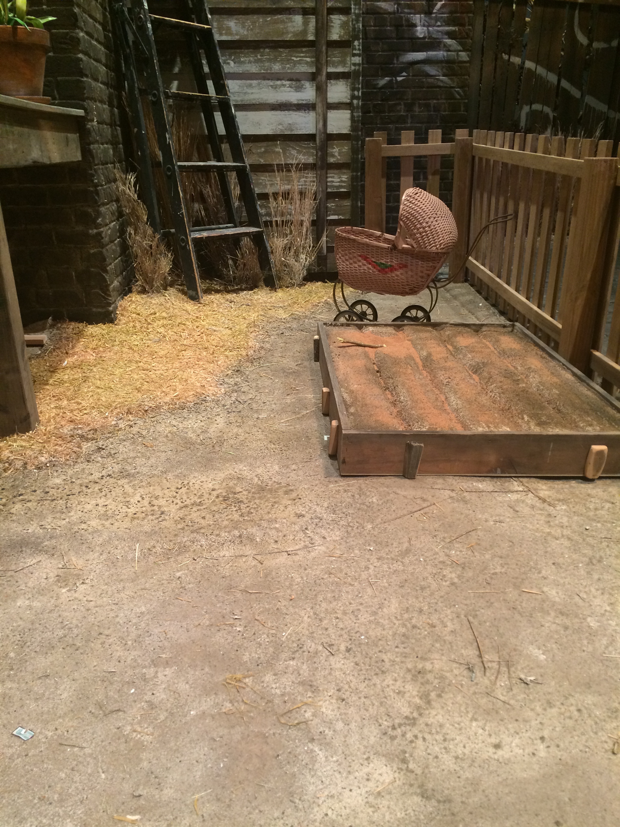  Indoor/outdoor carpet yard with elastomeric, walnut shell, paint and raffia texturing. &nbsp;Terrain contoured with foam underneath carpet. &nbsp; 