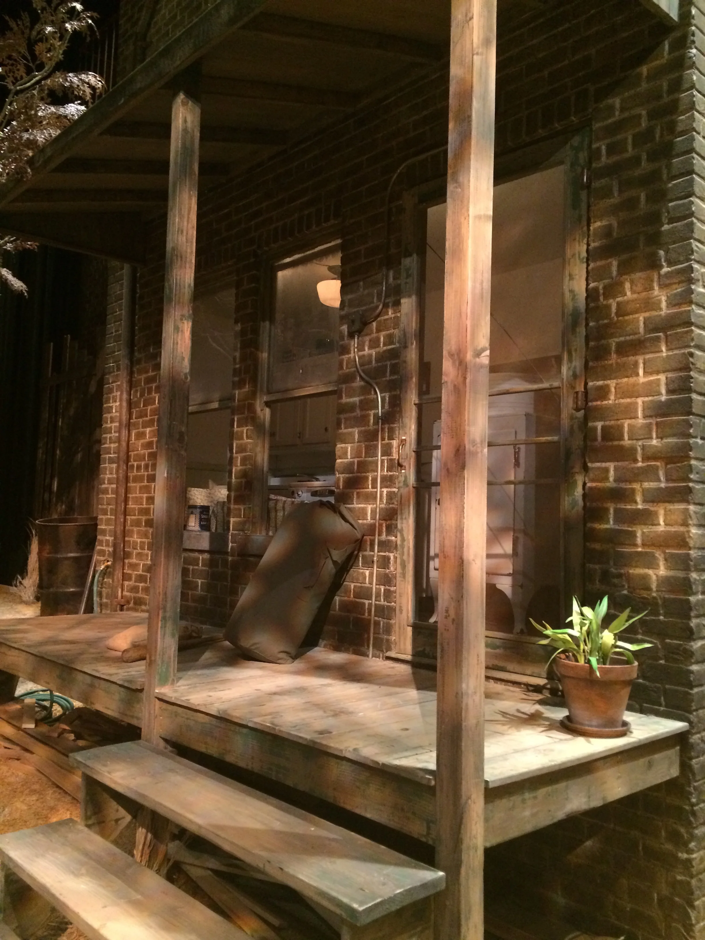  Porch brick and wood aging. &nbsp;Brick is carved homosote, coated and painted. &nbsp;Porch is distressed wood with aging and chipped paint treatment. 