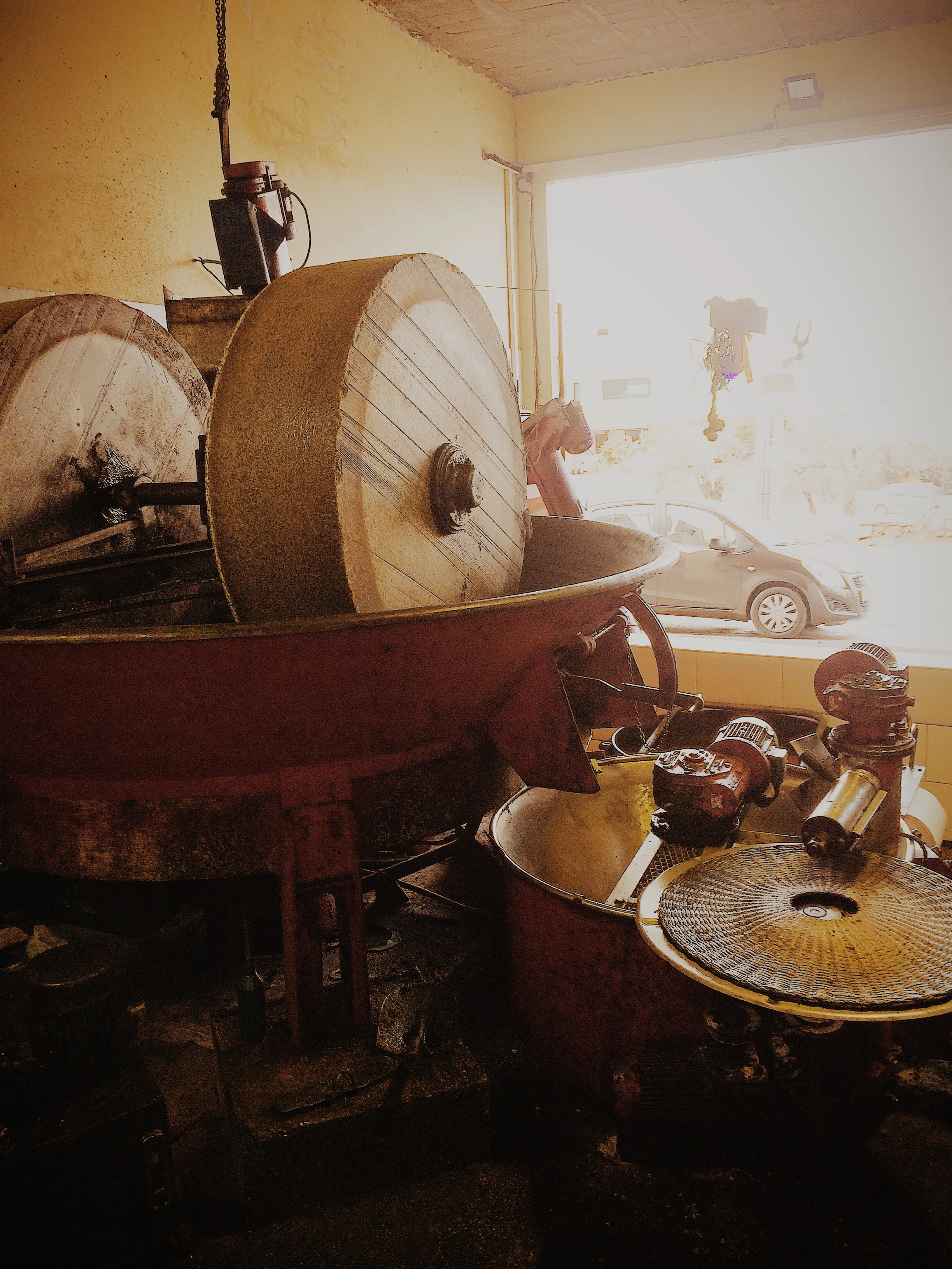 Although Israel produces a ton of Olive oil (pun intended), it is still a net importer. Here is a traditional olive oil press run by a miller. This being olive harvest season, he is rather busy crushing and pressing. Curiously, the currency of transaction is the oil itself! Harkens back to the age approved system of barter. 