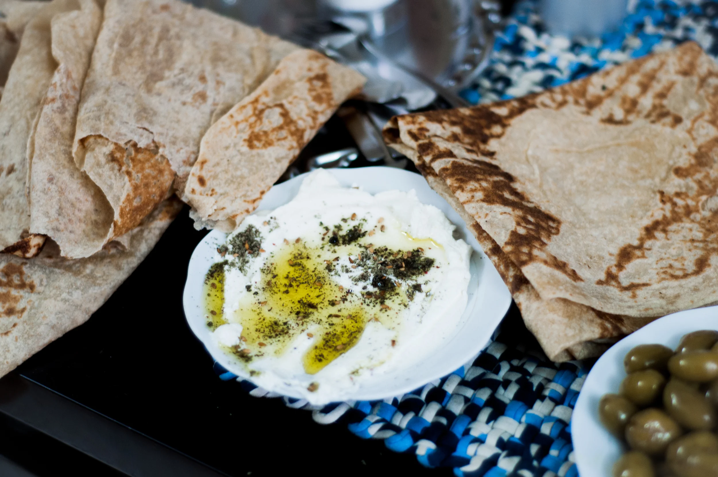 Yogurt is used extensively across Israel and all cultures. Labneh, the ever present strained yogurt cheese of the Middle East is something that is eaten in all meals and served to all visitors. Galilee is an olive growing region and many make their livelihood during the olive season from the trees. Preserved olives is not surprisingly one of the many starters often served.