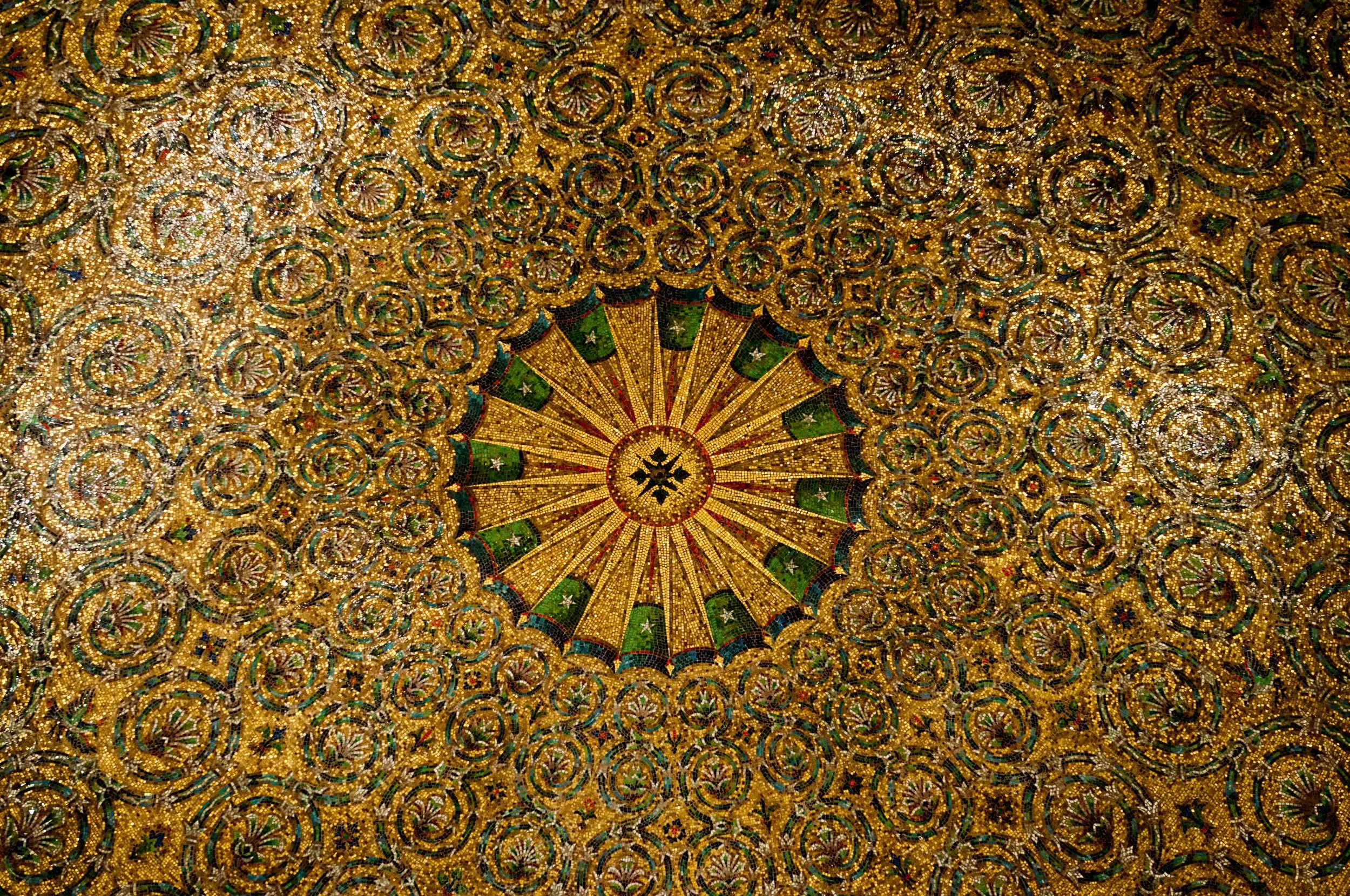 The stunning gilded ceiling as you enter into the lobby. It is not as vaulted as it appears. Cass Gilbert's cunning design worked with artist's skill to give the illusion of a ceiling higher than it is.