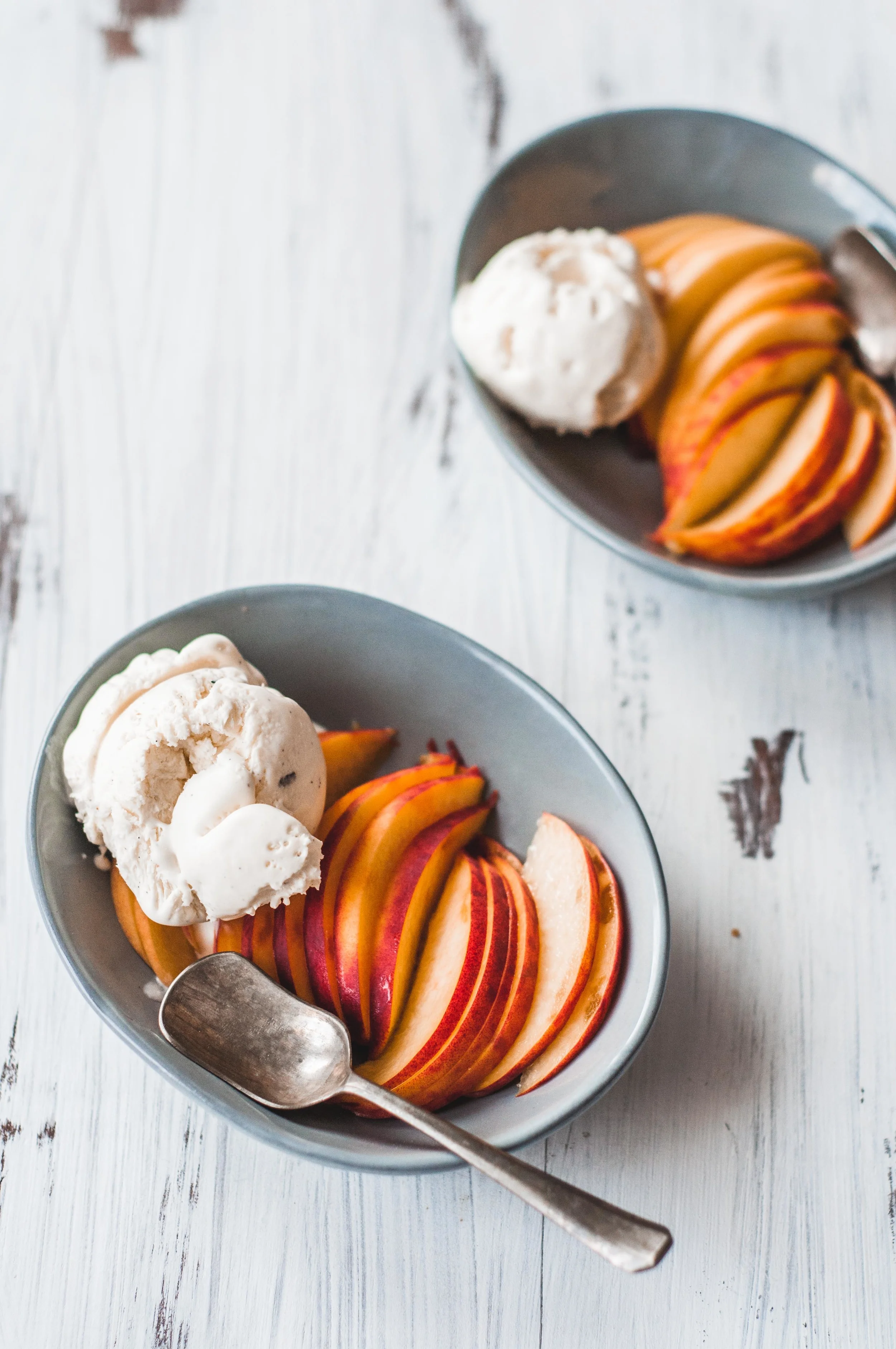 Summer Peaches sliced with a homemade no churn vanilla ice cream