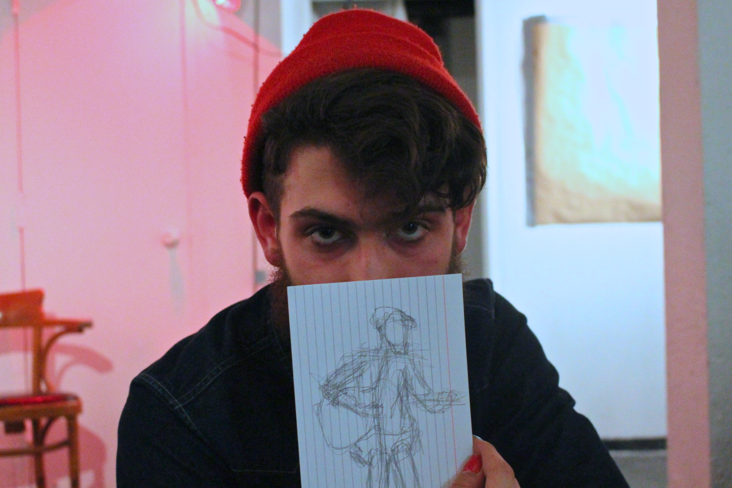  Guido Castellani '14 holds a sketch drawn during his performance 