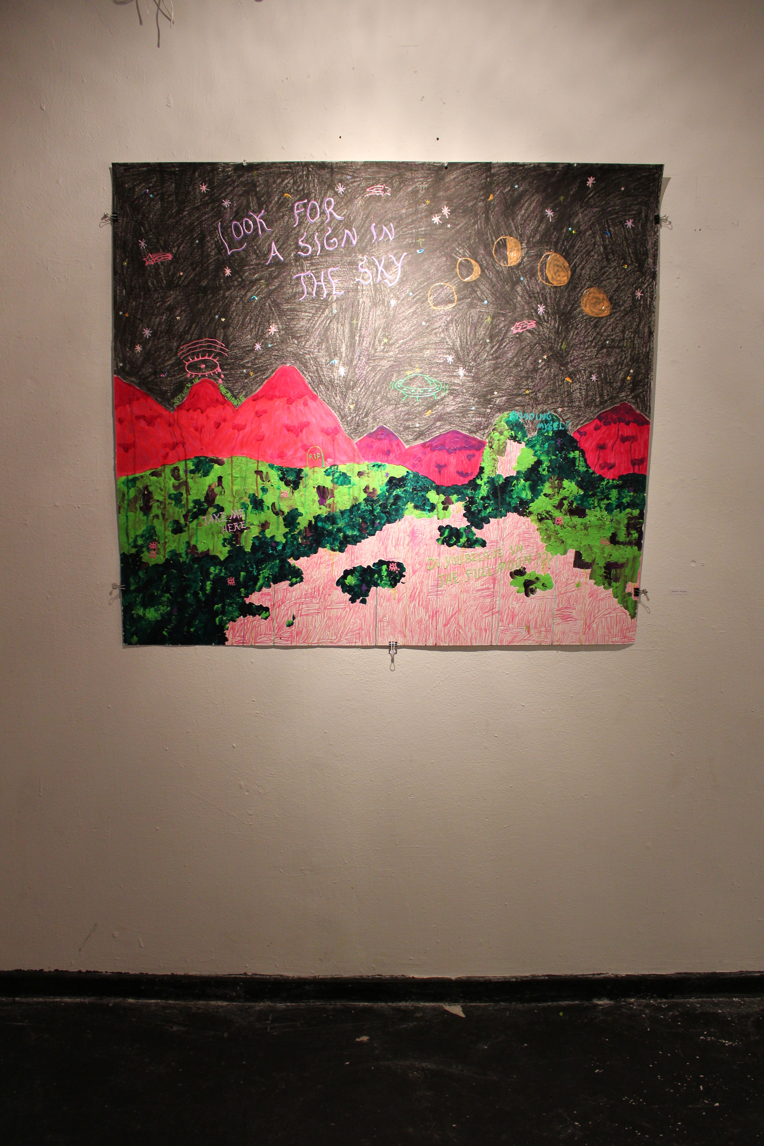   A cryptic mixed media piece by Jessica Butler '14 dominated one of the walls at the exhibit. Photo by Lexie Brown '17  