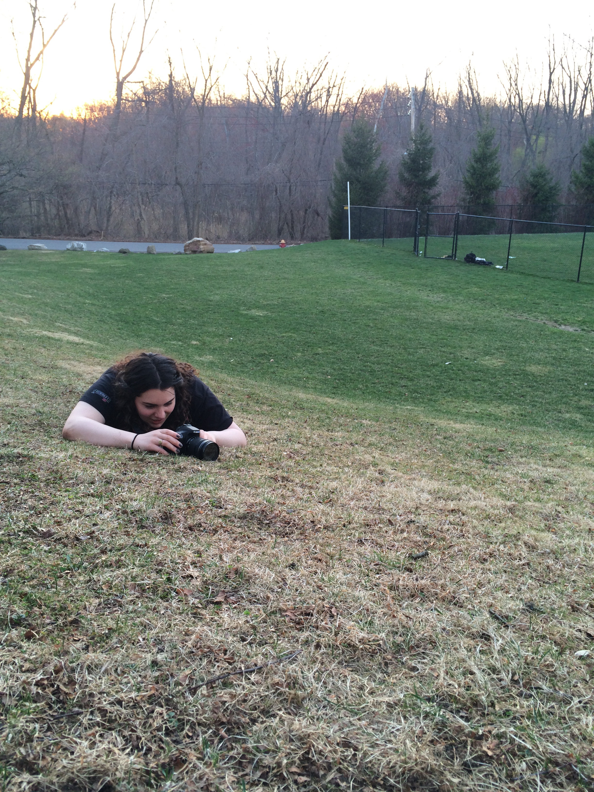 Levy lies on the ground to the get the perfect angle for a shot. Photos by Anna Ilina '15