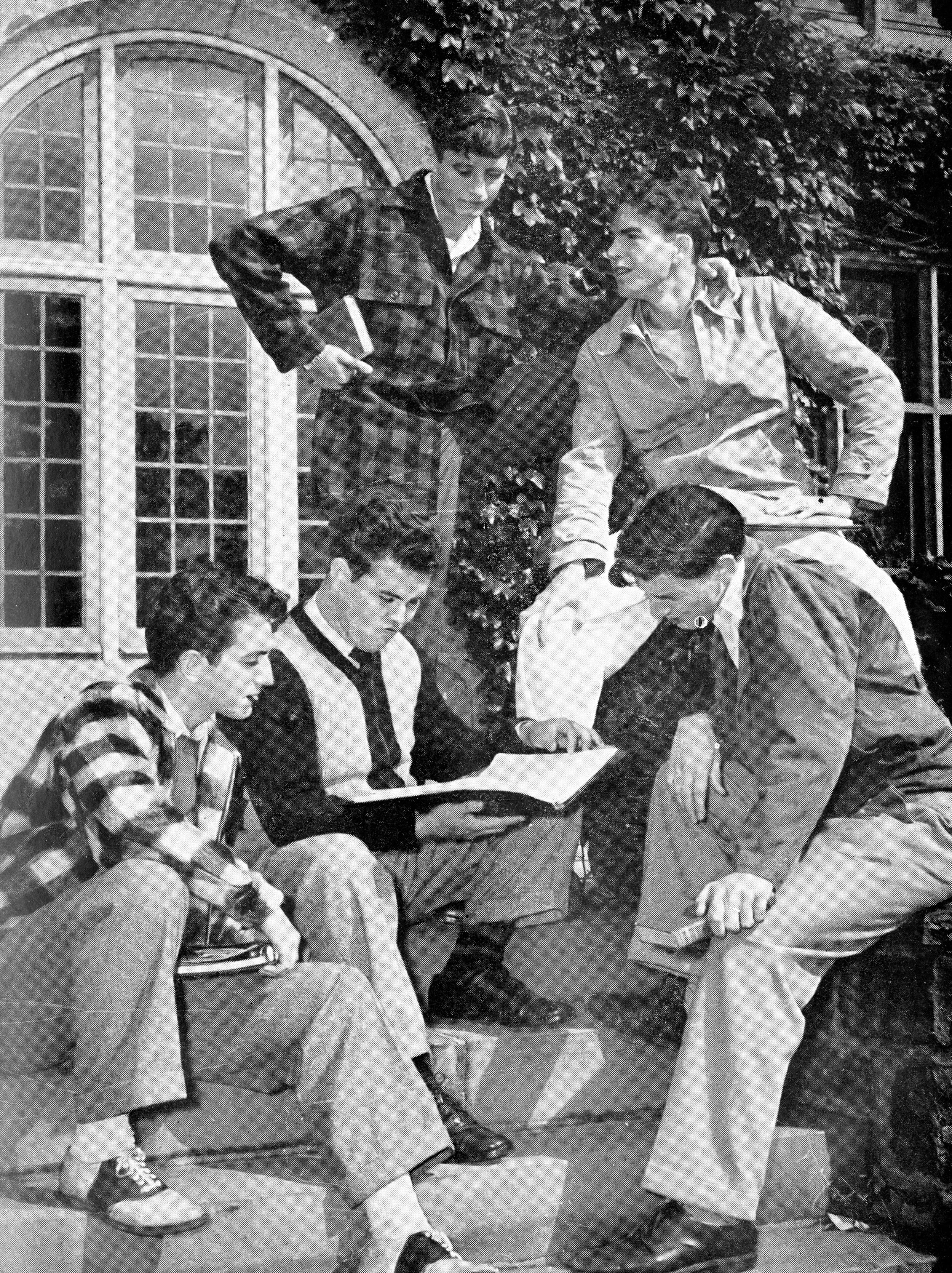Veterans permitted to attend SLC prior to the college's decision to go co-ed contemplate course offerings on the steps of Westlands in 1946. Photo courtesy Sarah Lawrence College Archives from the Sarah Lawrence Alumnae/i Magazine.
