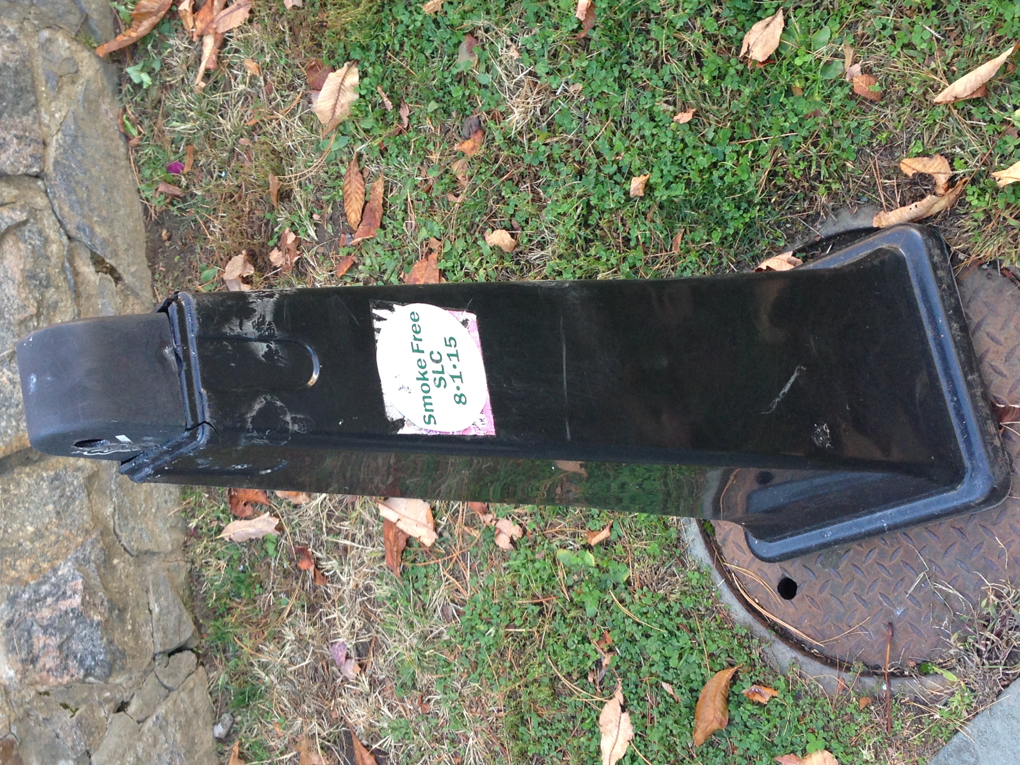 Reminders have been distributed to remind smokers that the smoking ban will go into effect August of next year. These stickers are on all smoking poles around campus. Photo by Hugh Thornhill '14.