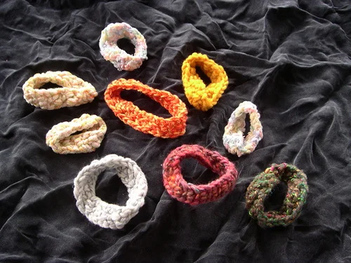 These are samples of Dr. Belcastro's mathematical knitting. Möbius bands, which act as both teaching tools and fashion accessories. Photo courtesy Dr. Sarah-Marie Belcastro