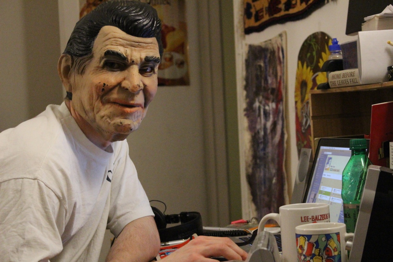 Vasaris Balzekas '17 poses behind a Ronald Reagan mask. Photo courtesy Ellie Brumbaum '17.