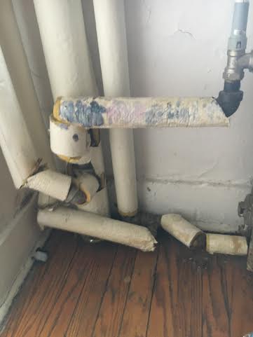 Broken down and discolored pipes in a Dudley Lawrence dorm room. Photo credit: Andrea Cantor