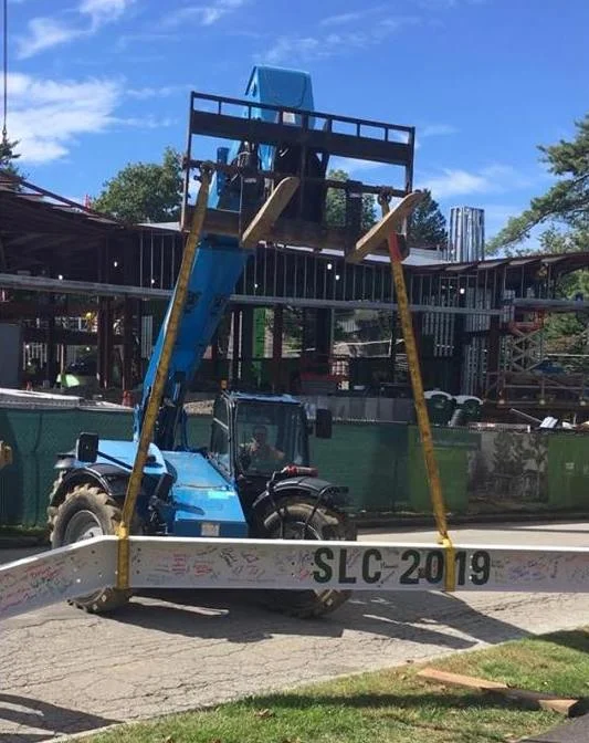 Seniors Sign Final Steel Beam in Barbara Walters Center