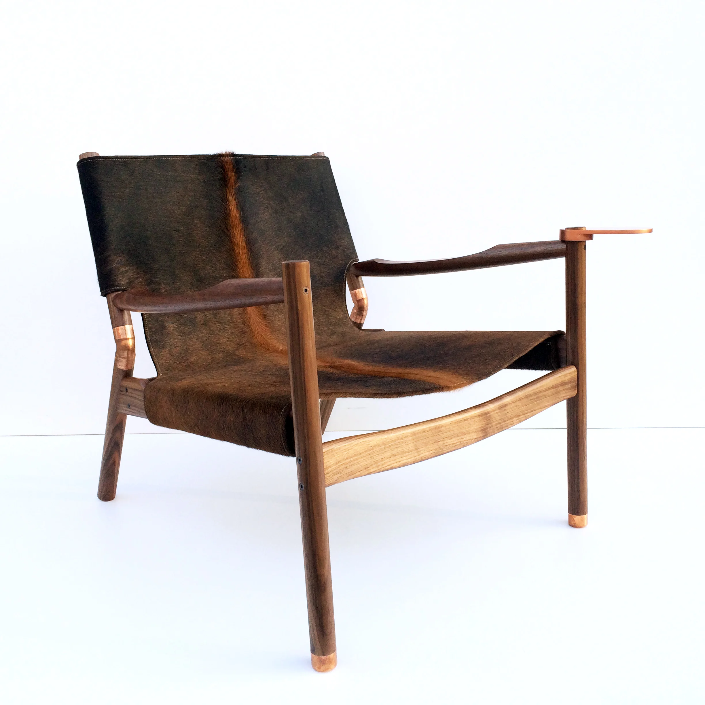 Brown brindle hide Black walnut Raw copper 28”H x 28” W x 31”D