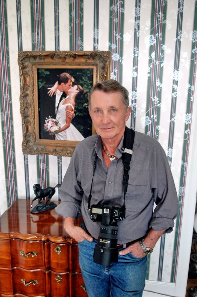 This is a portrait I took of Jerry in Floyd, VA. The photo behind him was one of his favorite wedding photographs.