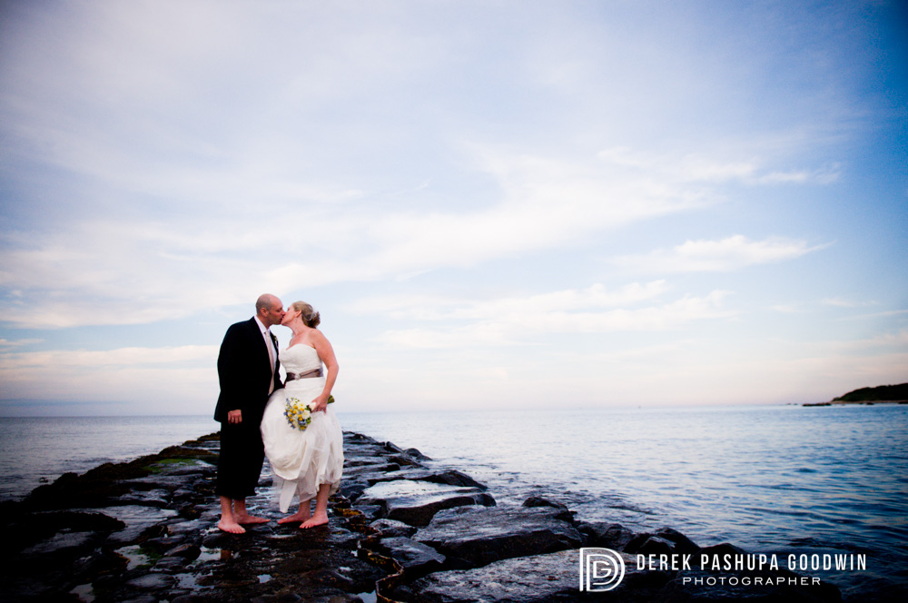 Bride & Groom kiss on the pier