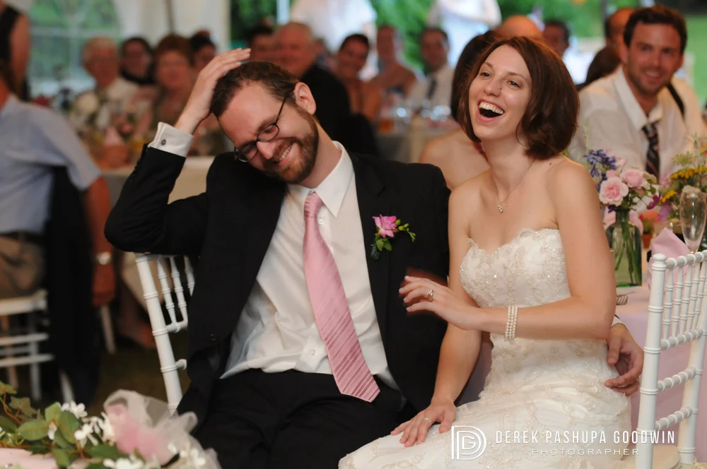 The bride and groom being toasted