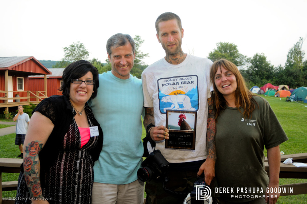 Jasmine Singer, Gene Bauer, Greg Straight Edge with Friend of Farm Animals award, and Susie Coston
