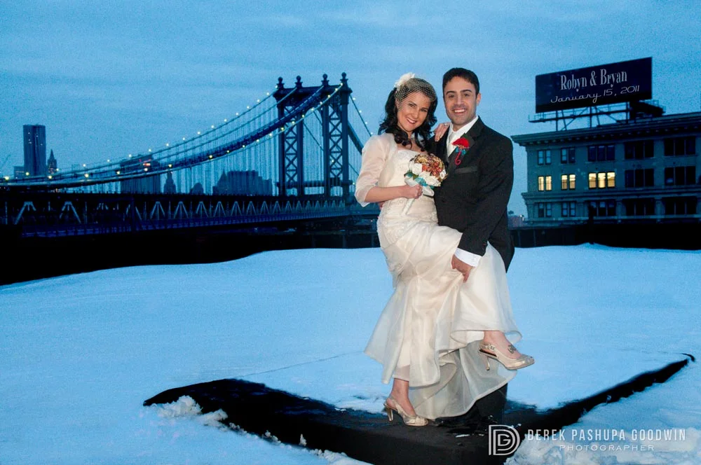 The bride and groom on ReBar rooftop overlooking the Manhattan Bridge