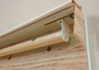 The other option for roller shades is a continuous cord operation. This choice provides a continuous loop cord on the side of the shade that allows you to control the height of the shade at any point--no spring at all. The cords themselves are selected to match the color of the fabric you select or you can match the cord to the color of the paint on the window trim if you want it to really disappear. The one thing to be sure of is that you request that your installer adds the child safety mechanism that attaches the loop cord to the trim. This is a mandatory safety device in most states now and it keeps the cord neatly out of the way.