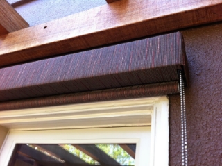 Fabric Covered Metal Fascia mounted over and exterior Solar Roller Shade