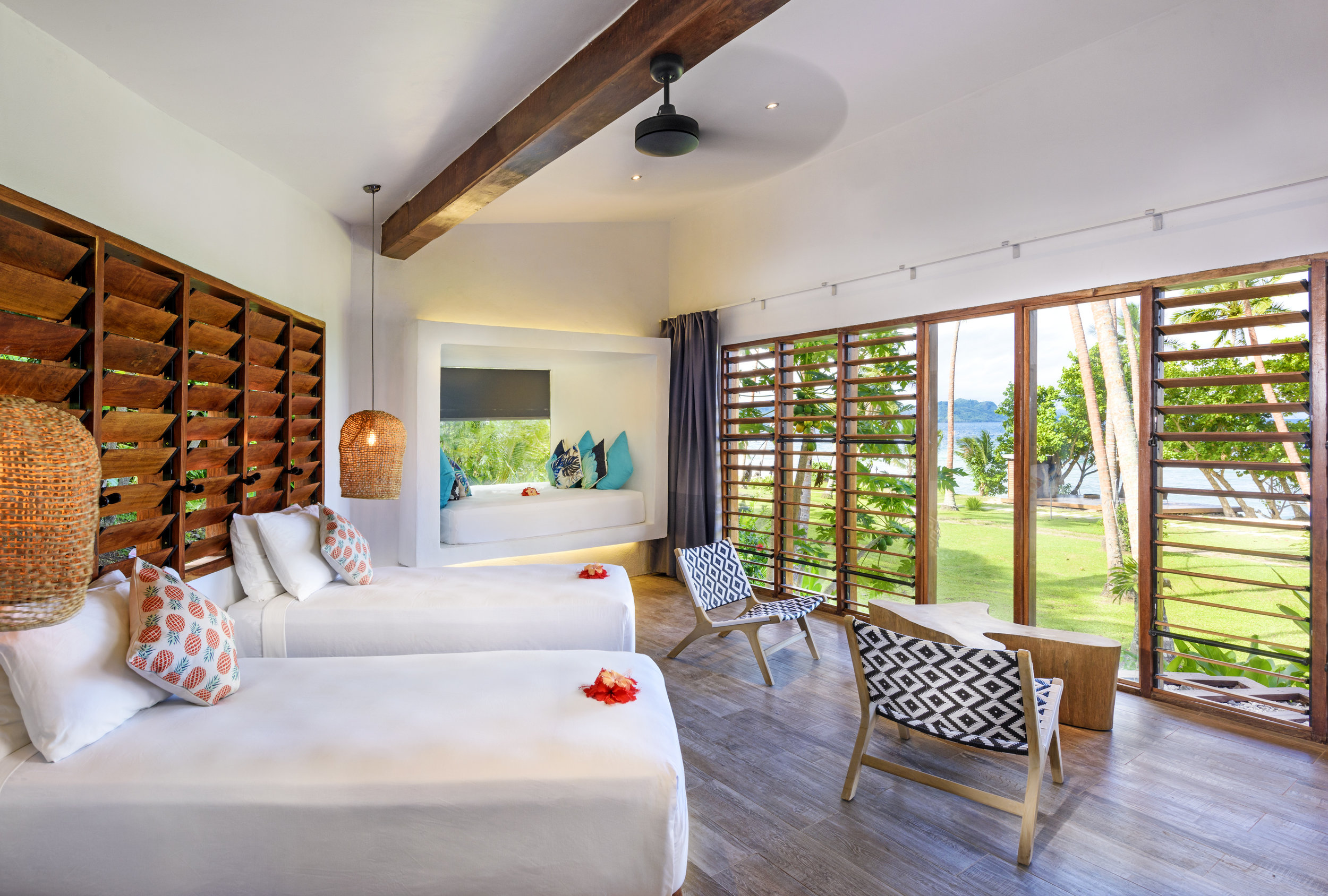 Two-bedroom Royal Retreat - Bedroom with a window bed and option for 2 single beds, The Remote Resort Fiji Islands