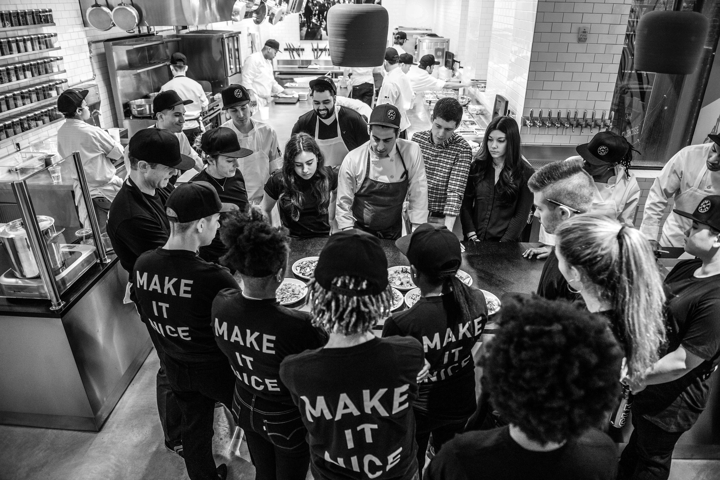 Team receiving demonstration in kitchen.jpeg