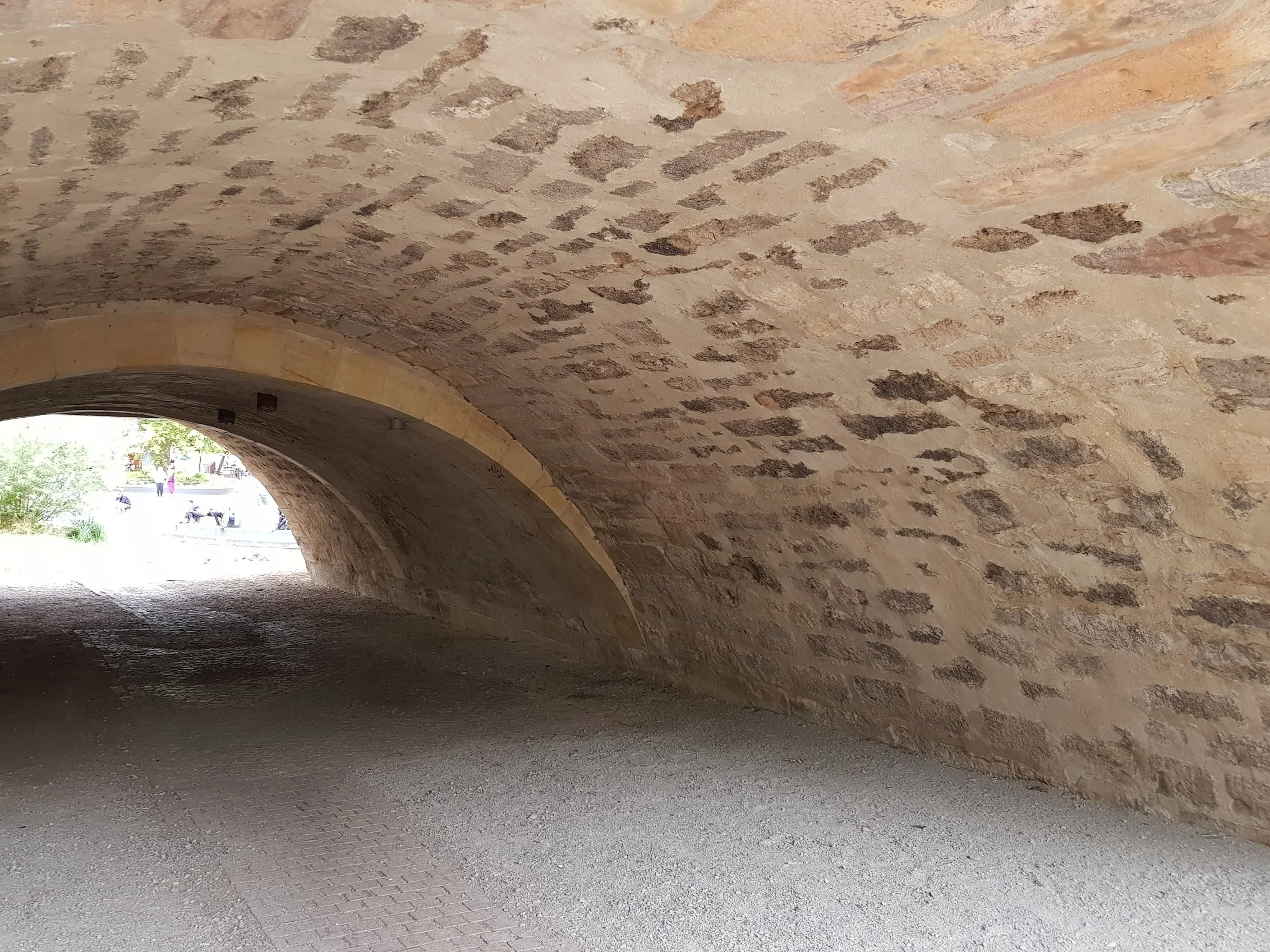 Here we see the original bridge in the middle with a widening each side. The dressed voussoirs are a give-away that the central strip is original.