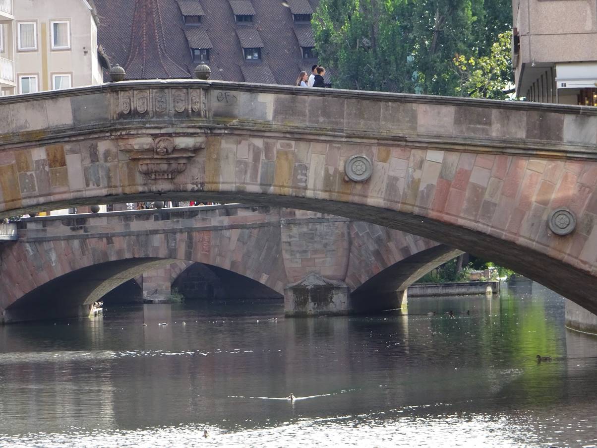 A view along the river from an island shows the congestion of bridges there is through Nuernberg.